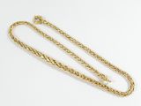 a gold chain with a clasp on a white background