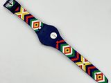 a close up of a colorful watch on a white surface