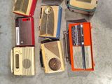 a lot of old radio ' s that are on the ground