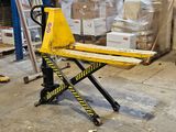a fork lift in the middle of a warehouse floor