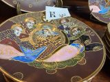 many decorative plates that are on a table