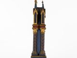 a close up of a clock tower on a white surface