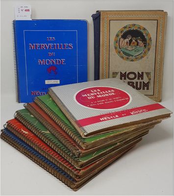 several books are stacked on top of each other on a table
