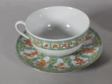 a cup and saucer sitting on a table
