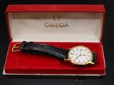 an image of a watch in a red box on a black surface
