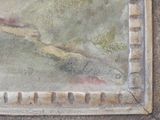 a painting on the wall of a building that has a bird on it
