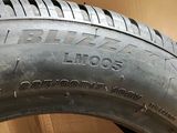tire tread of a car on a cardboard box with a cardboard box in the background