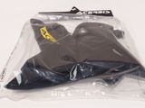 a plastic bag with a pair of skis in it