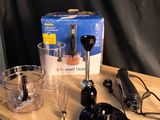 a wooden table with a blender, a blender and a blender on it