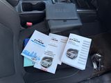 two books on the back seat of a car