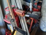 a pile of clutter and tools in a garage