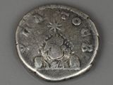 a silver coin with a picture of a man on it