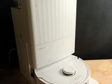 a white toilet sitting on top of a wooden table
