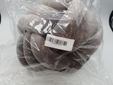 a bag of chocolate donuts sitting on a table
