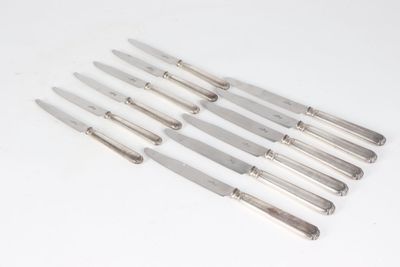 a set of six silverplated knives with a handle
