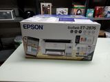 a box that is sitting on a table with a printer
