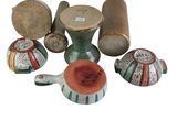 many different types of vases and bowls on the table
