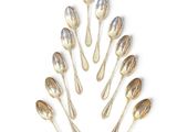 a lot of spoons and spoon spoons arranged in the shape of a tree