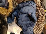 a pile of clothing that is piled up on the floor