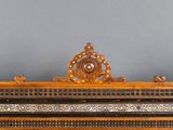 a wooden frame with a clock on top of it