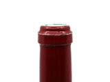 a bottle of wine that is sitting on a table