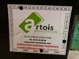 a label on the back of a machine that says artois