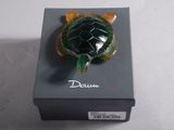 a turtle that is sitting on top of a box