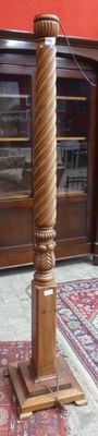 a tall wooden pole with a clock on top of it