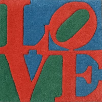 a close up of a red, green and blue love sign
