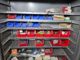 many bins of assorted items on the shelves in the room