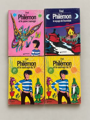 three children ' s books are lined up on a white surface