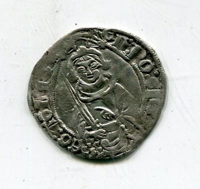 une vieille pièce d'argent sur laquelle figure l'effigie d'un homme