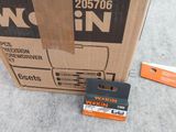 a cardboard box and a pair of scissors on the ground