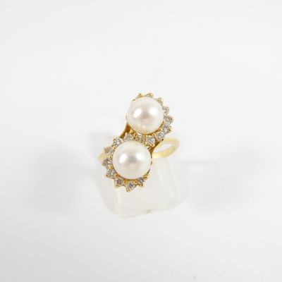 an image of a pearl and diamond ring on a white background