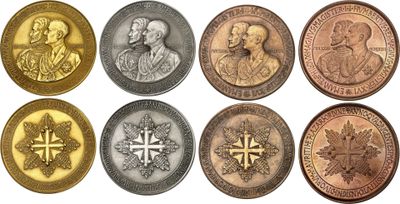 a close up of a bunch of coins on a white surface
