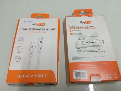 packaging of a white and orange box containing a usb cable and a usb - c cable