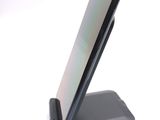 a cell phone that is sitting on top of a stand