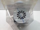 a small plastic box with a flower inside of it