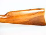 the rifle is made of wood and is ready to be used