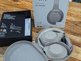 a box of headphones sitting on a wooden table