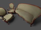 un canapé, un fauteuil et un pouf dans un salon