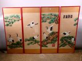 four panel screen with cranes and pine trees painted on it