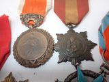 many medals that are on display on a table