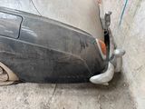 a close up of a car ' s front bumper and fender