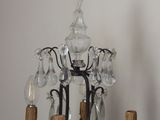 a chandelier that is hanging on the wall