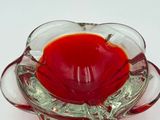 a glass bowl with a red liquid inside of it
