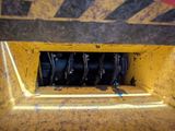 a close up of a yellow and black truck with wheels