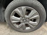 a close up view of a tire on a car