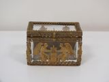 brass and glass box with angels and angels on it on a white surface