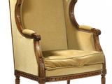 an image of a chair with a beige upholstered seat and a wooden frame
